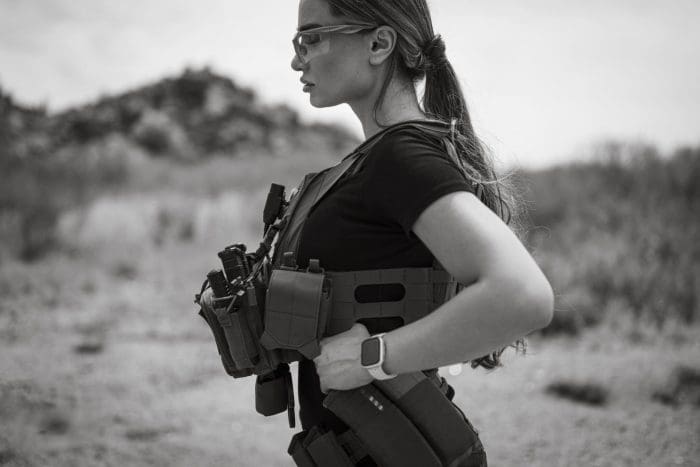 A Woman wears RMA 1118 Level IV plates in a QPC plate carrier.