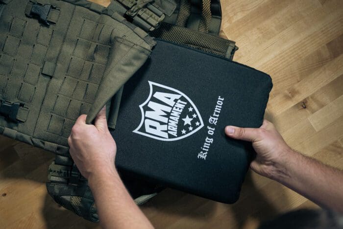 Inserting a ballistic plate into a plate carrier.